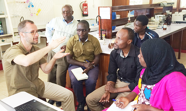 Dr. Aleš Soukup (L) interacts with Staff and Students from the Department of Plant Sciences, Microbiology and Biotechnology, CoNAS during his visit to Makerere University, Kampala Uganda