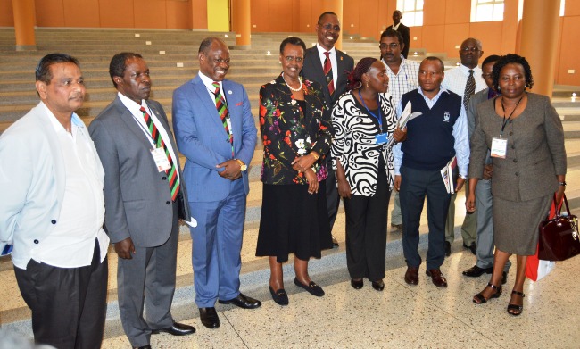 First Lady and Minister of Education and Sports-Hon. Janet Museveni (C) flanked by Vice Chancellor-Prof. Barnabas Nawangwe (3rd L), Deputy Vice Chancellor (Finance and Administration)-Prof. William Bazeyo (2nd L) and other members of Management, Government Officials and EXCEL Construction representatives during a tour of Central Teaching Facility 2, 23rd April 2018, Makerere University, Kampala Uganda.