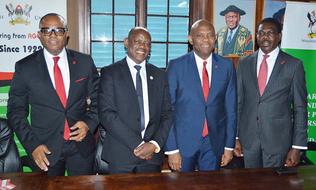 Mr. Tony Elumelu (2nd R) and the Vice Chancellor-Prof. Barnabas Nawangwe (2nd L) pose for a group photo with UBA's Mr. Manz Denga (L) and Mr. Johnson Agoreyo (R) after the courtesy call on 11th April 2018, Makerere University, Kampala Uganda