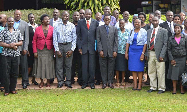 First Deputy Vice Chancellor(Academic Affairs), Dr. Ernest Okello Ogwang (Centre), Director DRGT-Prof. Mukadasi Buyinza (to his Left), Dr. Paul Kibwika (to his right) with other participants during the official opening of The three-day workshop, 24th May 2018, Royal Suites Bugolobi, Kampala Uganda