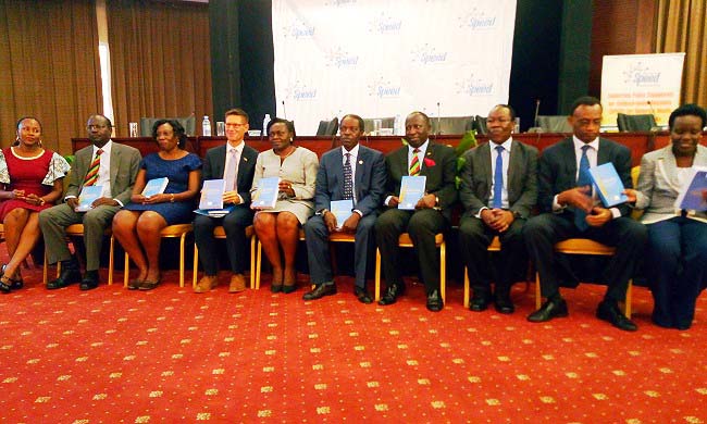 The State Minister for Primary Health Care, Hon. Sarah Opendi (5th L), EU Acting Head of Cooperation, Mr Thomas Tiedemann (4th L), Acting DVCFA, Prof. William Bazeyo (5th R) with the UHC Book Authors L-R: Dr. Suzanne Kiwanuka, Deputy Dean of MakSPH, Prof. Christopher Garimoi Orach, Commissioner MoH-Dr. Esther Byakika, Principal CHS, Prof Charles Ibingira, Assoc. Prof Freddie Sengooba, Prof. Elizeus Rutebemberwa and Dr Elizabeth Ekirapa-Kiracho at the Launch on 3rd May 2018, Serena Hotel, Kampala Uganda.