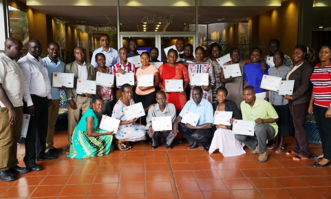 Health care professionals from 13 Regional Referral Hospitals, 5 District Hospitals, and 6 Health Facilities in Kampala City where TB treatment show off their certificates after the CTCA facilitated training on  integrating tobacco cessation services into TB services, June 2017 Kampala, Uganda