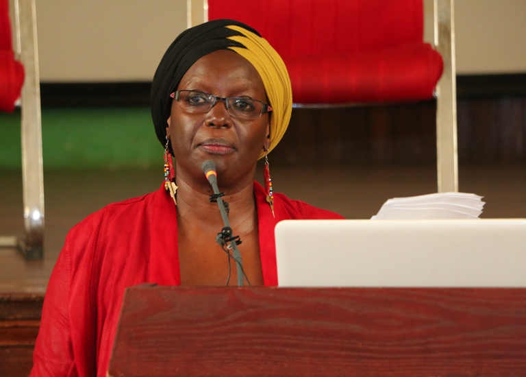 The Chairperson of the Committee Prof. Sylvia Tamale presenting the report.