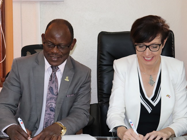 The Vice Chancellor of Makerere University-Prof. Barnabas Nawangwe and the Ambassador of France-H.E Stéphanie Rivoal signing a Memorandum of Understanding for the Kampala Geopolitics Conference scheduled to take place on Friday 26th and Saturday 27th October 2018 at Makerere University.