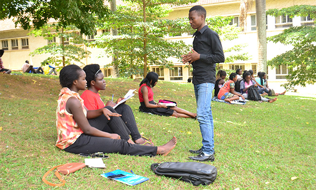 Students in discussion groups near College of Humanities and Social Sciences