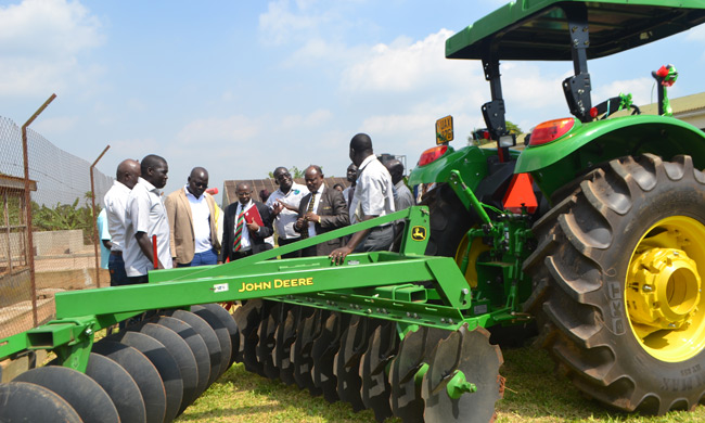 Vice Chancellor Prof. Barnabas Nawangwe (2nd Left)  flanked by Dr Richard Edema (3rd Left), Prof Bernard Bashaasha (4th Left) and other members of staff from the College of Agricultural and Environmental Sciences during a tour of equipment procured by MARCCI.
