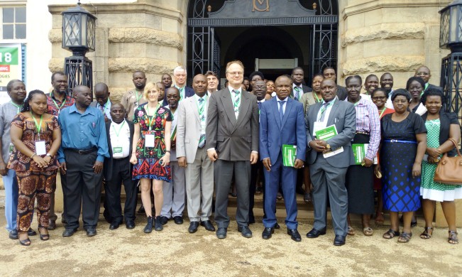 Principal CoBAMS-Dr. Eria Hisali (5th R) with the Rector of University of Agder, Prof. Frank Reichert (6th R), Principal CEES, Prof. Fred Masagazi Masaazi (4th R) and other participants at the opening day of DELC 2018, 9th July 2018, Makerere University, Kampala Uganda