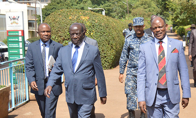 The Vice President-H.E. Edward Kiwanuka Ssekandi (2nd L) upon arrival at Makerere University, Kampala Uganda for the inaugural Prof VL Ongom Memorial Lecture. He was received by Vice Chancellor-Prof. Barnabas Nawangwe (R) and Acting DVCFA-Dr. Eria Hisali (L)