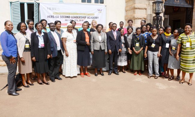 Prof. Mary Okwakol (7th L) flanked by Director DRGT-Prof. Buyinza Mukadasi (8th L), University Librarian-Dr. Hellen Byamugisha (6th L) Ag. Director GMD-Dr. Euzobia Mugisha Baine (5th L), Director HRD-Mr. Andrew Abunyang (4th L), Ms. Frances Nyachwo-GMD (3rd L), facilitators and participants of the HERS-EA Second Academy at the opening ceremony, 2nd July 2018, Makerere University, Kampala Uganda