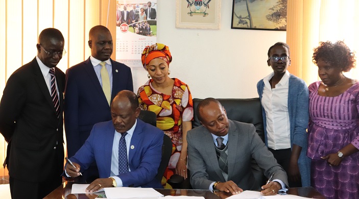 The Vice Chancellor of Makerere University, Prof.  Barnabas Nawangwe and the Chairman, Board of Africa Strategic Leadership Centre, Dr. Robert Mwesigwa Rukaari  signing the MoU on behalf of the two institutions respectively; witnessed by,Samia Yaba Nkrumah, Rt. Hon. Daniel Kidega, Irene Ikomu,  Prof. Edward Kirumira,  and Dr. Nansozi K. Muwanga.