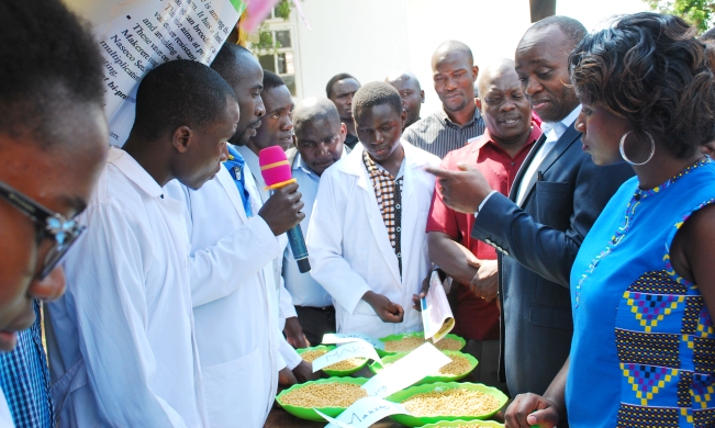 Prof. Archileo Kaaya-Head, Department of Food Technology, Nutrition and Bioenginering (2nd R) accompanied by other officials inspects one of the students' exhibitions, 27th July 2018, MUARIK, Makerere University, Wakiso Uganda