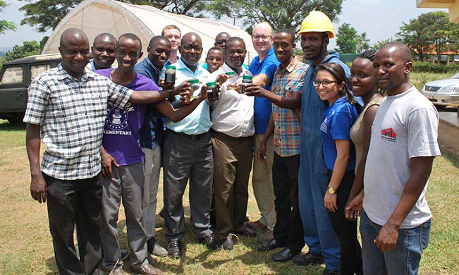 Project PI-Prof. Noble Banadda (7th R) and the University of Kentucky's Assoc. Prof. Jeffrey Seay (6th R) with other Co PIs and Students show off samples of the bio-diesel made from plastics at the Agricultural Engineering Workshop, MUARIK, Makerere University, Wakiso Uganda. Prof. Banadda is the first African to wint the Distinguished Pius XI Gold Medal