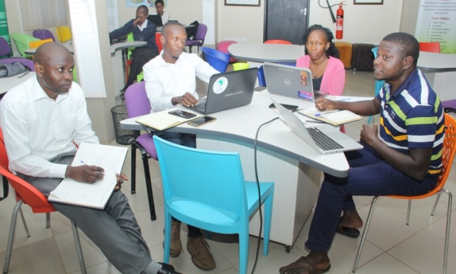 Famunera Innovator (R) interacts with RAN staff during his pitch on 17th July 2018, RAN Offices, Upper Kololo Terrace, MakSPH, Makerere University, Kampala Uganda. Image:RAN