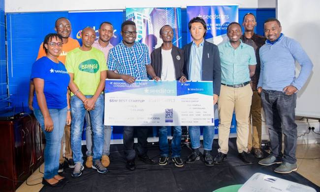 Agro Supply Uganda Limited's CEO-Ogwal Joseph (3rd L) and IT Specialist-Watson Atwine (4th L) with competition judges shortly after been crowned Best Startup on 24th August 2018, Outbox Hub, Soliz House, Lumumba Avenue, Kampala Uganda. Image:Seedstars