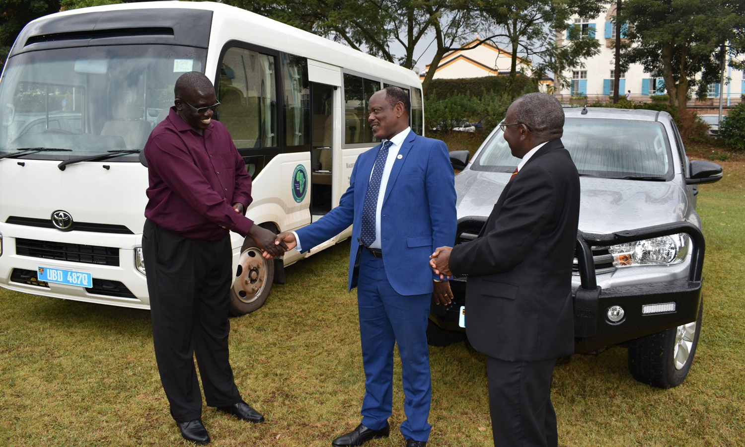MaRCCI Centre Director Dr. Richard Edema (Left) shakes hands with Vice Chancellor Prof Barnabas Nawangwe (Centre) as Prof. Bernard Bashaasha looks on.