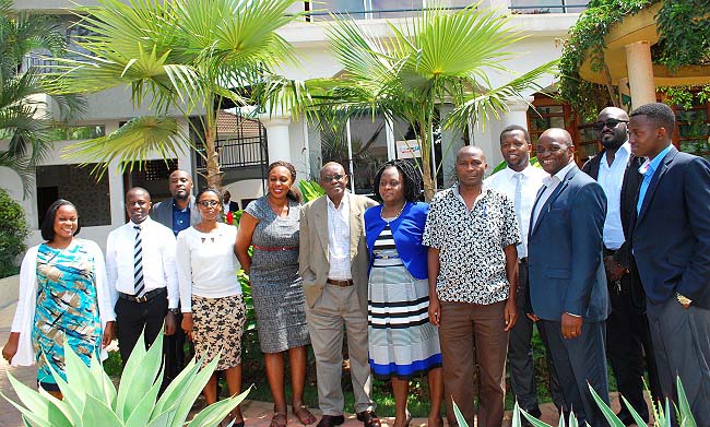 Prof. Archileo Kaaya (3rd R) along with other participants pose for a group photo at the CAADP Malabo Declaration Action Planning Meeting on 30th August 2018, Fairway Hotel, Kampala Uganda