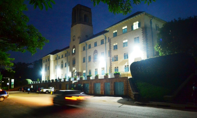 The Main Building and parking lot as seen at dusk, Makerere University, Kampala Uganda