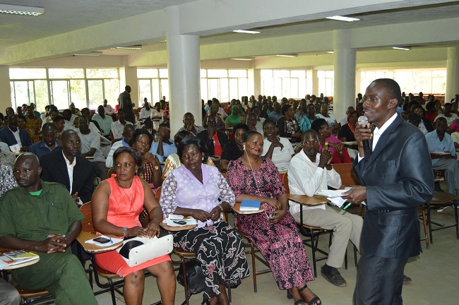 Mr. Joseph Musoke, the representative of the support staff on the Makerere University Council, interacting with the participants.