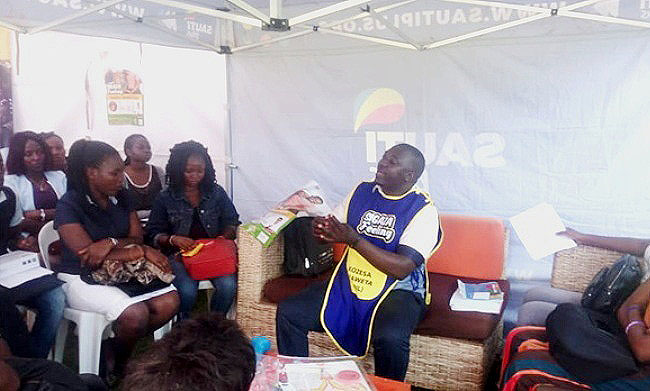 A PSI Staff Member educates female students about family planning as the 84th Guild Annual Health Camp kicked off on 16th October 2018, Freedom Square, Makerere University, Kampala Uganda