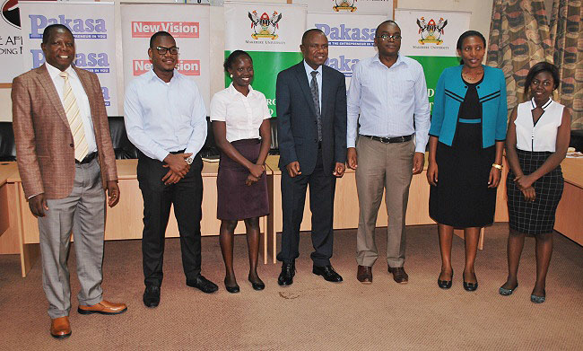 The Principal CoBAMS-Prof. Eria Hisali (C),  Dr. Peter Turyakira (L), Dr. Cathy Mbidde (2nd R) New Vision's Mr. Joseph Byaruhanga and a colleague (2nd L & 3rd R respectively) and the article authors Rachael Kanyi (3rd L) and Esther Joyce Nakibombo (R) after the Media Briefing on 8th October 2018, CoBAMS, Makerere University, Kampala Uganda