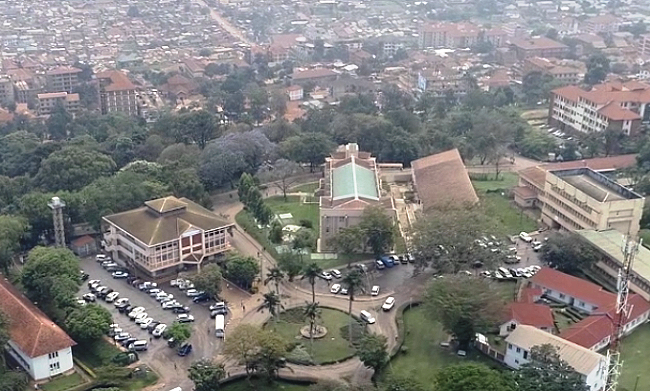 An aerial view of the Colleges of Natural Sciences-CoNAS, Agriculture-CAES, Engineering-CEDAT, School of Statistics, Departments of Chemistry and Mathematics. Partly visible in the background is the surrounding Kikoni neighbourhood, October 2018, Makerere University, Kampala Uganda