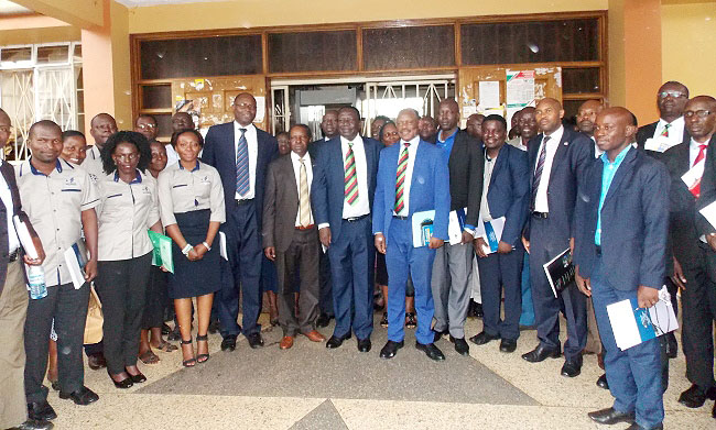 The Chairperson Council-Eng. Dr. Charles Wana Etyem and Vice Chancellor-Prof. Barnabas Nawangwe (Centre in Mak ties), DVCFA-Prof. William Bazeyo (Next to Chair Council) and Chairperson MURBS Board of Trustees-Mr. Wilber Grace Naigambi (Next to Prof. Bazeyo) with MURBS Departmental Ambassadors, Service Providers and Staff after the Press Conference on 16th October 2018, Senate Building, Makerere University, Kampala Uganda