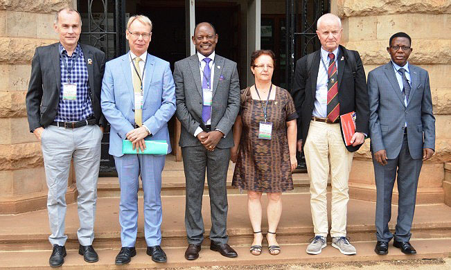 Swedish Ambassador-H.E. Per Lindgärde (2nd L), Vice Chancellor-Prof. Barnabas Nawangwe (3rd L), Swedish Embassy Head of Cooperation-Mr. Ola Hällgren (L), Swedish Embassy 1st Secretary and Senior Research Advisor-Dr. Gity Behravan (3rd R), Prof. Leif Abrahamsson-ISP Uppsala (2nd R) and Director DRGT-Prof. Buyinza Mukadasi (R) pose for a group photo at the start of the Annual Review Meeting, 1st October 2018, Makerere University, Kampala Uganda