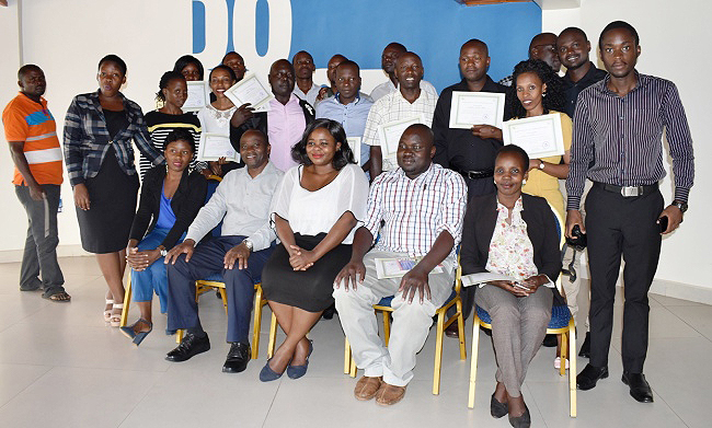 The Patron-Prof. Archileo Kaaya (Seated 2nd L) and AUC-PACA Program Officer-Ms. Wezi Chunga-Sambo (Seated C) pose for a group photo with journalists after the training on 30th October 2018, Fairway Hotel, Kampala Uganda