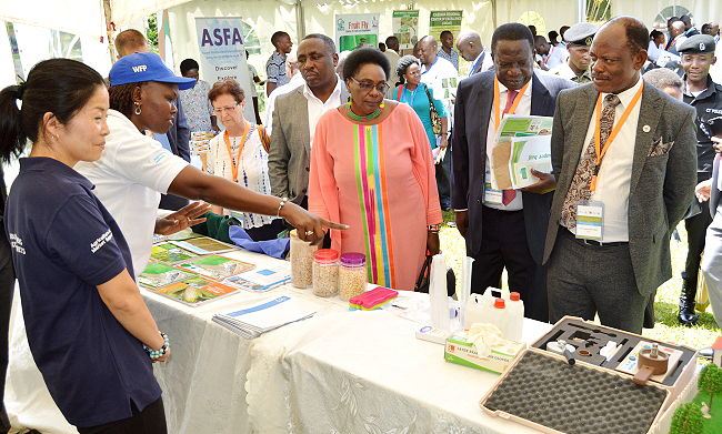 R-L: Prof. Barnabas Nawangwe, Eng. Dr. Charles Wana-Etyem, Hon. Mary Karooro Okurut, Hon. Christopher Kibazanga, Dr. Gity Behravan and other officials tour the WFP Exhibition during the 2nd NARO-MAK Conference, 12th November 2018, Speke Resort Munyonyo, Kampala Uganda