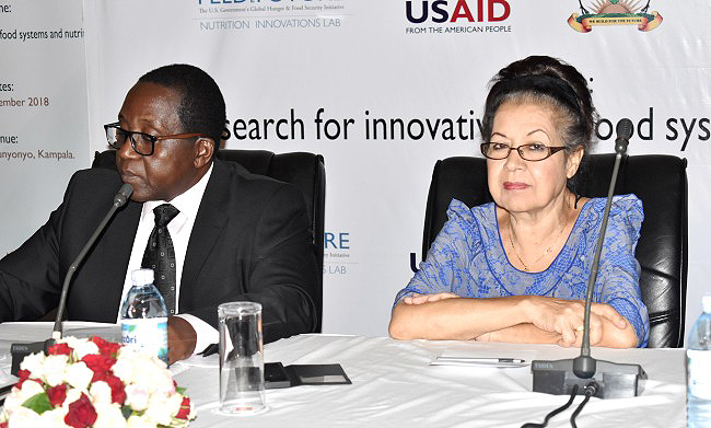 Ms. Forough E. Olinga, a Gender Mainstreaming and Training Consultant (R) with Session Chair and Principal, College of Veterinary Medicine, Animal Resources and Biosecurity-Prof. John David Kabasa (L) on Day4 of the NARO-Mak Conference, 15th November 2018, Speke Resort Munyonyo, Kampala Uganda