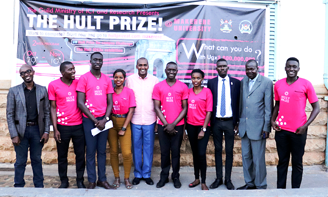 The Hult Prize at Makerere On-Campus Challenge Team poses for a group photo with Guest of Honour and  Minister of ICT and Communications-Hon. Frank Tumwebaze (5th L) DVCAA-Dr. Ernest Okello Ogwang (2nd R) and Mr. Arinaitwe Rugyendo (L) after the Grand Finale on 8th November 2018, Makerere University, Kampala Uganda