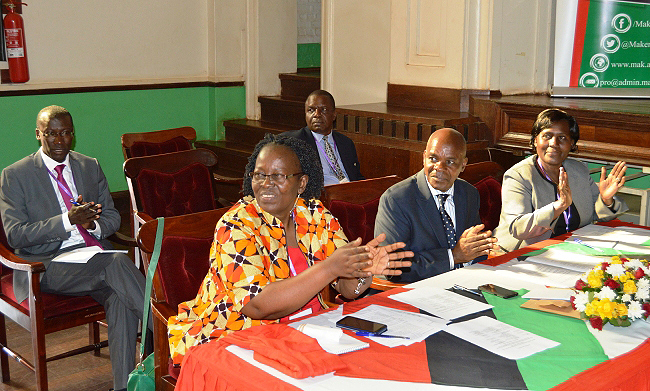 The Senate Search Committee Members From Right to Left: Dr. Florence  M. D’ujanga, Prof. J.Y.T Mugisha (Chairperson), Dr. Gilbert Maiga (Rear), Prof. Grace Bantebya Kyomuhendo and Dr. Frank N. Mwine applaud as recognitions of guests in attendance were made during presentations by Candidates for the position of DVCAA, 5th November 2018, Makerere University, Kampala Uganda.
