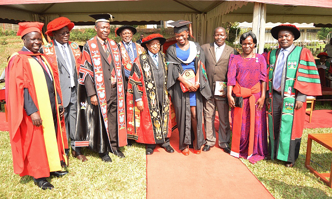 The best overall student at the 68th Graduation, Ms. Nyamenya Caroline (4th R) poses for a photo with the Chancellor-Prof. Ezra Suruma (Centre), her parents (2nd and 3rd Right) and L-R: Convocation Chair-Dr. Tanga Odoi, MUBS Principal-Prof. Waswa Balunywa, Academic Registrar-Mr. Alfred Masikye Namoah and Vice Chancellor-Prof. Barnabas Nawangwe on Day 3 of the Ceremony, 18th January 2018, Freedom Square, Makerere University, Kampala Uganda.