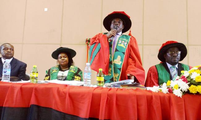 R-L: Deputy Principal CEES-Dr. Paul Birevu Muyinda, Executive Secretary UBTEB-Mr. Oyesigye Onesmus (CPA), National Coordinator of the Centre for Life Long Learning-Mrs. Rose Atugonza and an official at the Centre's Graduation Ceremony on 19th January 2019 in the CoBAMS Auditorium, Central Teaching Facility 2, Makerere University, Kampala Uganda