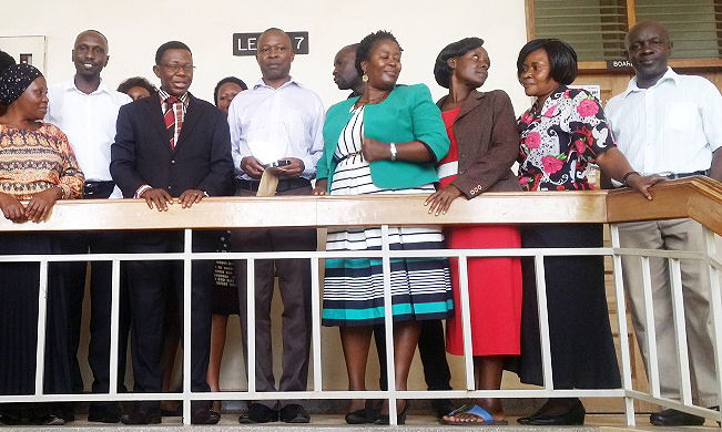 Director, DRGT-Prof. Buyinza Mukadasi (3rd L) with the Best DRGT Employee 2018-Mr. Allan Kizza (4th L), Runner Up-Mr. Dickens Piriyo (2nd L) and DRGT Staff after the awards ceremony on 28th January 2019, Senate Building, Makerere University, Kampala Uganda