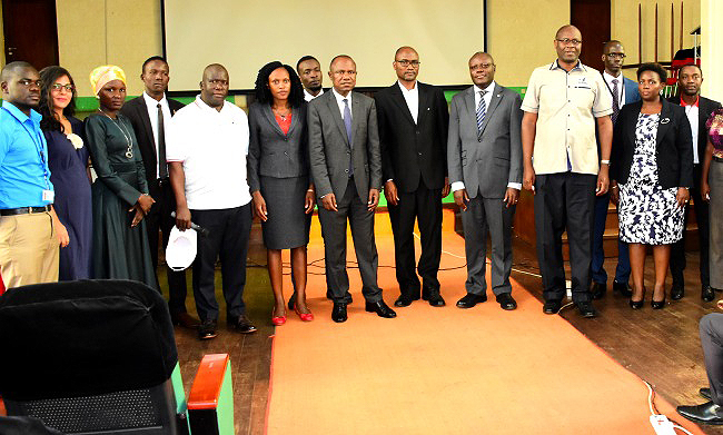 The Principal CoBAMS-Dr. Eria Hisali (7th R), Deputy Principal CoBAMS-Dr. Bruno Yawe (6th R) Ag. CEO URBRA-Mr. Martin Nsubuga (5th R), MURBS Chairperson BoT-Mr. Wilber Grace Naigambi (4th R), Mrs. Susan Muhumuza Nyatia-URBRA (2nd R), Benjamin K. Mukiibi-URBRA (R), Director- Communication and Public Affairs URBRA-Hajji Hassan Nakabaale (5th L) and other officials at the 2nd URBRA Seminar on 19th February 2019, Makerere University, Kampala Uganda