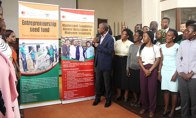 Dr. Eria Hisali (Centre with Mic) is joined by Mastercard Foundation Scholars Program Staff (MCFSP), Alumni and students to launch the Entrepreneurship Seed Fund  and MCFSP Alumni Association on 15th February 2019, Makerere University, Kampala Uganda. The Seed Fund worth US$200,000 is in line with the Foundation’s two-year Strategy Young Africa Works