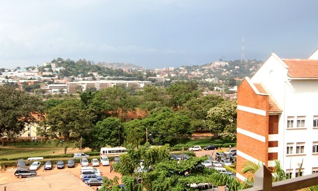 Background L-R: The College of Health Sciences and Mulago Hospital Complex, Naguru and Kololo Hills as seen from the Main Library, Makerere University, Kampala Uganda