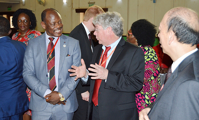 The Vice Chancellor, Prof. Barnabas Nawangwe (2nd L) chats with NC State's Dr. Craig Yencho as Dr. Bailian Li – Senior Vice Provost for Global Engagement (R) listens during the summit opening day on 11th March 2019, Makerere University, Kampala Uganda
