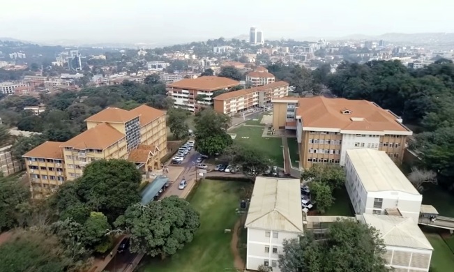 An aerial photo of the School of Social Sciences, CHUSS and Central Teaching Facility (CTF) 1 to the right, Senate Building to the left and Lincoln Flats and College of Computing and Information Sciences (CoCIS) in the Centre and Pearl of Africa Hotel in the background