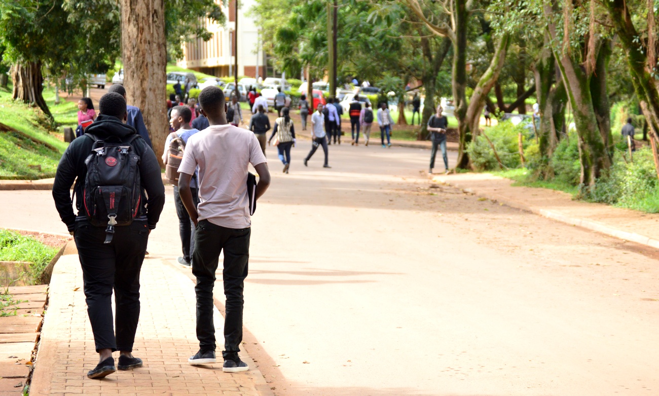 Students walk along Lincoln Close on the Main Campus, Makerere University, Kampala Uganda