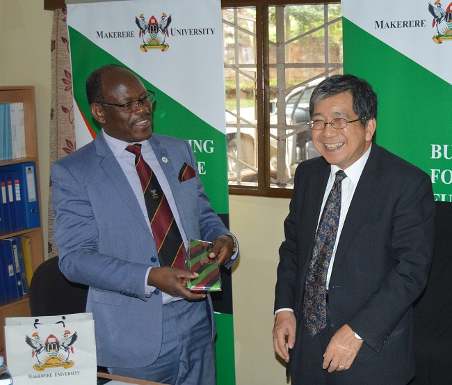 The Vice Chancellor, Prof. Barnabas Nawangwe (Left) presents the Mak necktie to Japanese Ambassador H.E. Kazuaki Kameda (Right) during his visit to the AICAD Uganda Country Office on 17th April 2019, Makerere University, Kampala Uganda
