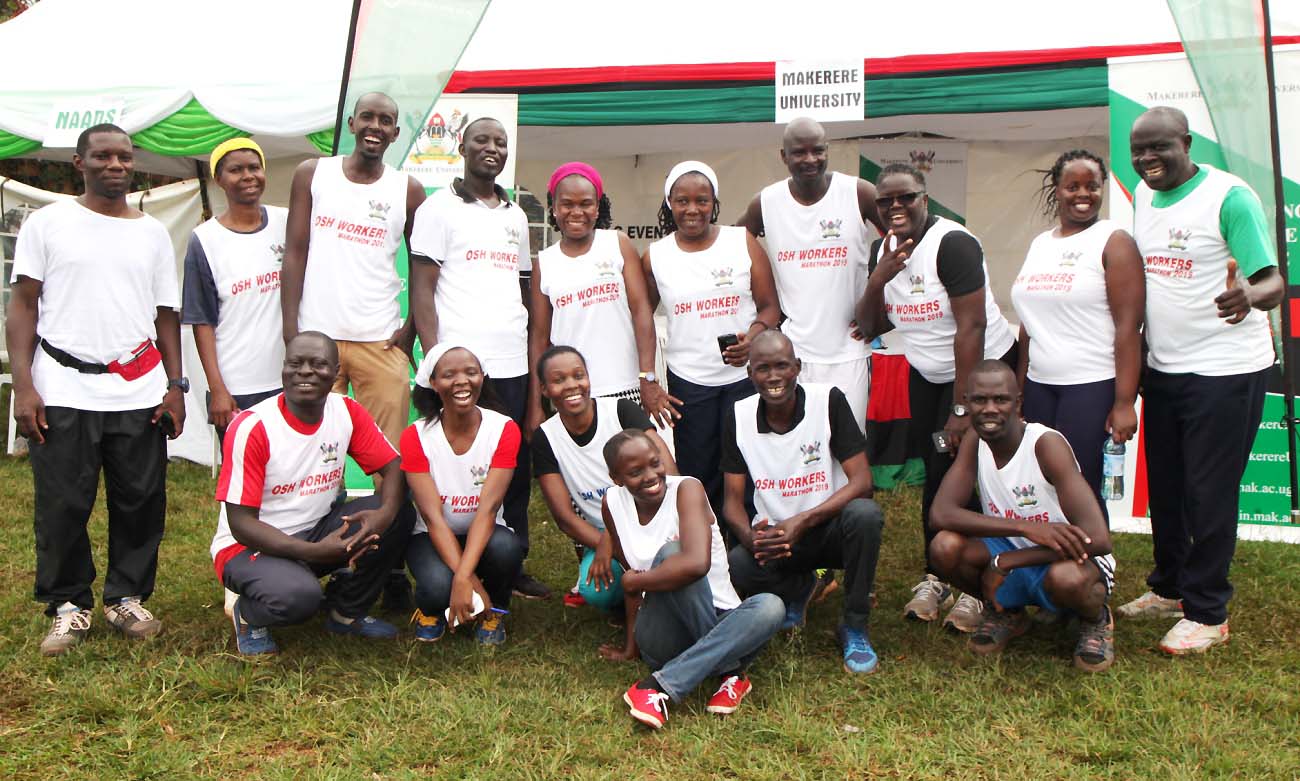 Makerere University Staff Team that took place in the Workers' OSH Marathon 2019 pose for a group photo before set off on 28th April 2019, UMA Show Grounds, Lugogo, Kampala Uganda