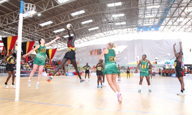 Mary Nuba soars high to receive a pass during the last group game of Uganda Vs South Africa on 21st September 2018 at the World University Netball Championship 2018, Makerere University, Kampala Uganda