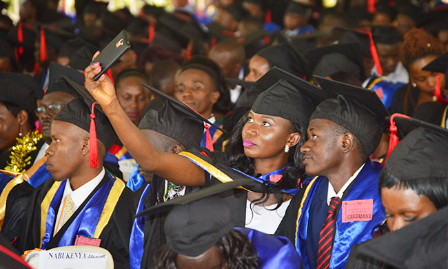 A graduand takes a selfie during the 68th Graduation Ceremony in January 2018