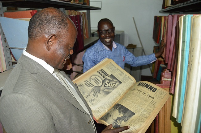 Prof. Barbanas Nawangwe looking at one of the Munno Publication that is archived in the Makerere University Library.