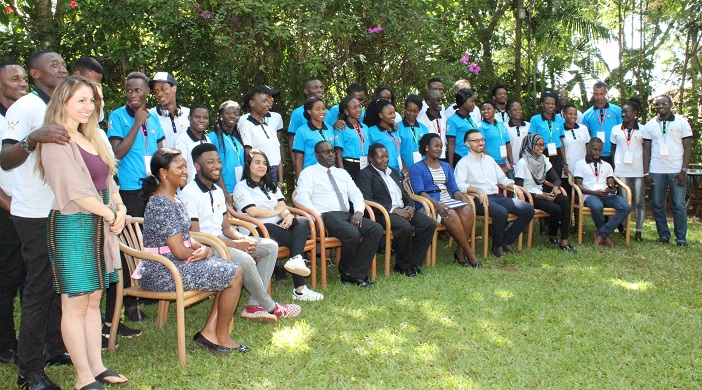 Students from Makerere University and the University of Edinburgh in Scotland posing for a photo with some of the trainers at  the  launch of the Pearl of Africa Leadership Camp.