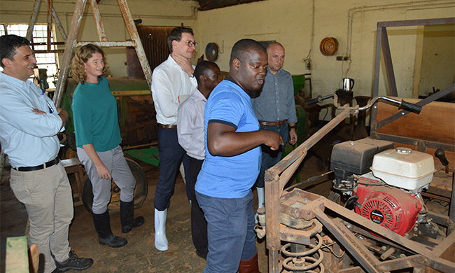 Prof. Noble Banadda shows the delegation from Belgium Embassy around the Mechanical Workshop at MUARIK. In a white shirt is First Secretary and Deputy Head of Cooperation at the Embassy of Belgium in Uganda, Mr. Alexandre Brecx