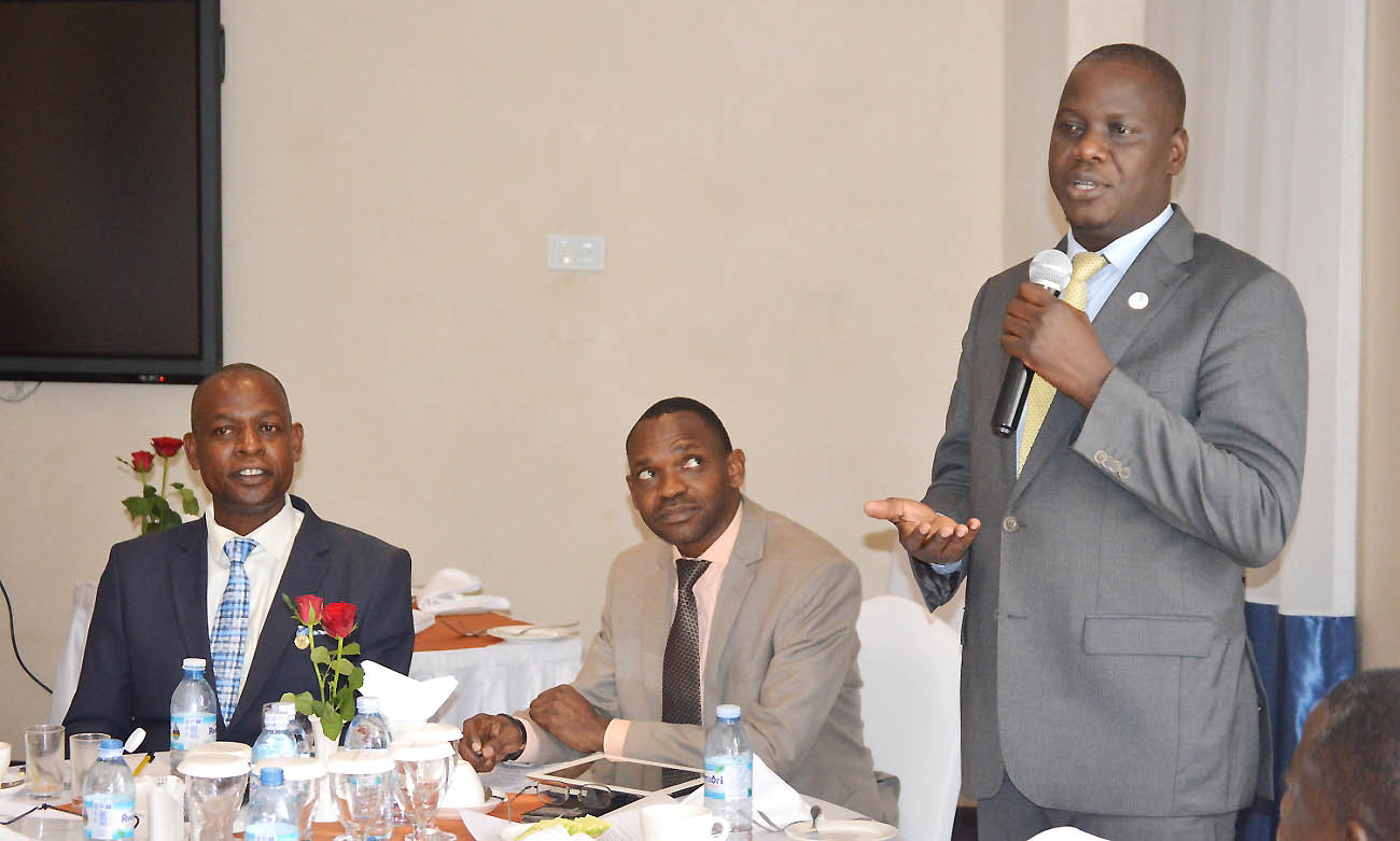 The Vice Chairperson Makerere University Council, Rt. Hon. Daniel Fred Kidega (Right) makes the concluding remarks as the DVCAA-Dr. Umar Kakumba (Centre) and Director QAD-Dr. Vincent Ssembatya (Left) listen at the Self-Assessment Breakfast Meeting, 9th May 2019, Golden Tulip Hotel, Kampala Uganda.
