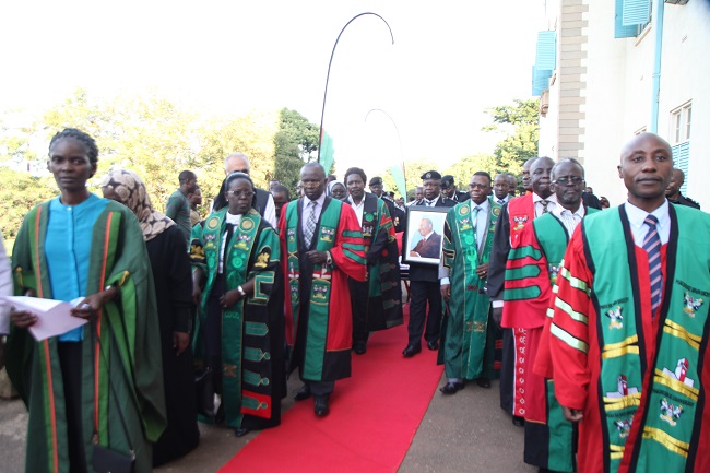 RESPECT: Makerere University staff in their academic gowns receiving the body of Prof. Apolo Nsibambi.Prof. Nsibambi was the first non-Head-of-State Chancellor of Makerere University, a position he held from October 2003 to October 2007.